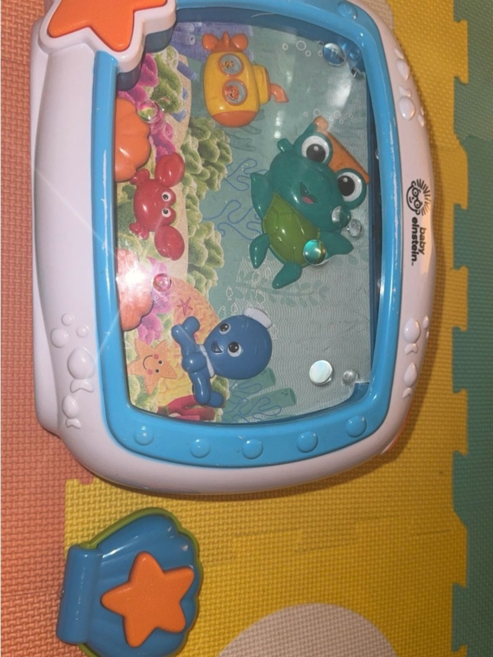 Baby Einstein Blue and White Ocean Water Play Toy with Orange Star Button